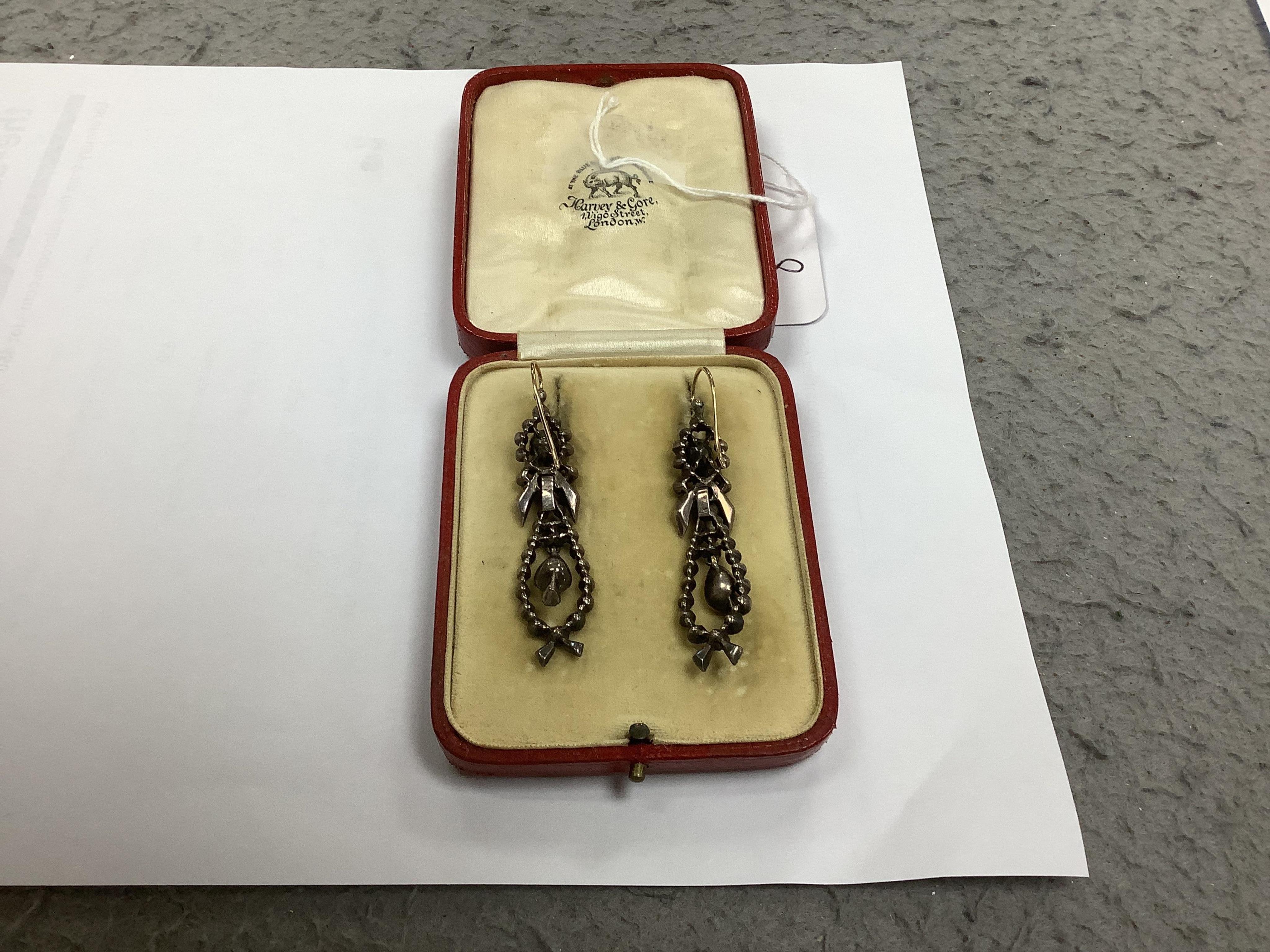 A pair of early 19th century silver, foil backed quartz and flat cut diamond set articulated drop earrings